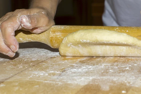 Hands with rolling kneading dough — Stock Photo, Image