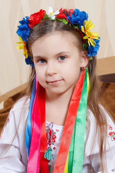 Little girl with a bright wreath — Stock Photo, Image