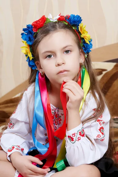 Little girl with a bright wreath — Stock Photo, Image