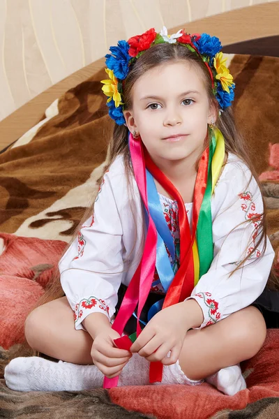 Little girl with a bright wreath — Stock Photo, Image