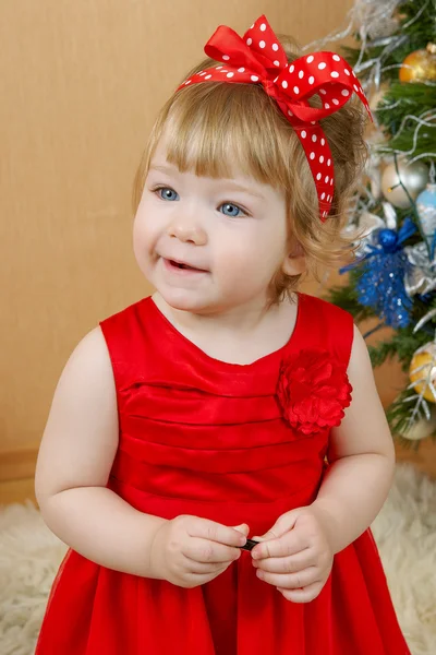 Cute laughing girl in red dress — Stock Photo, Image