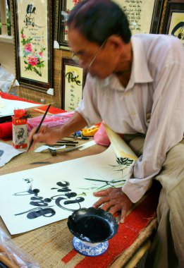 People writing chinese calligraphy clipart