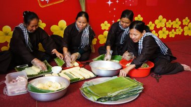 Group of people making traditional Vietnam food for Tet