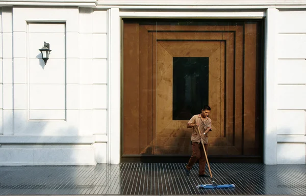 Young man working on five star hotel lobby — Stock Photo, Image