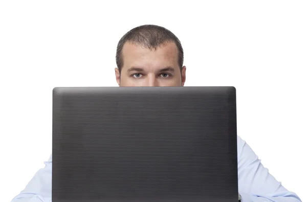 Hiding behind laptop — Stock Photo, Image