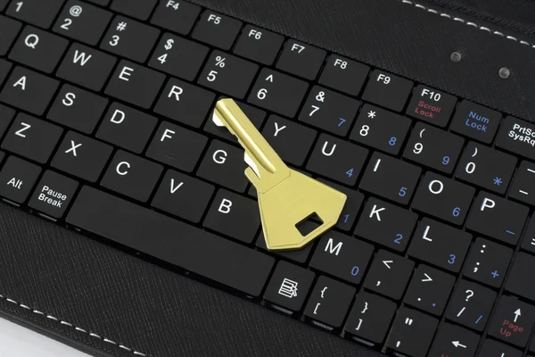 Golden Key on the Computer keyboard — Stock Photo, Image