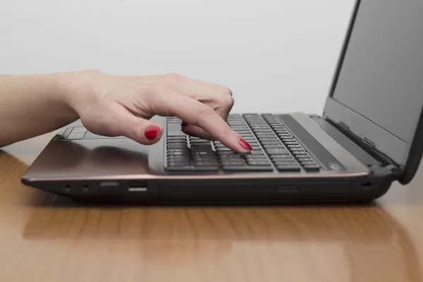 Touch the keyboard with the index finger — Stock Photo, Image