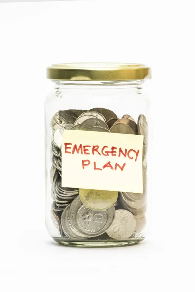 Isolated coins in jar with emergency plan label — Stock Photo, Image