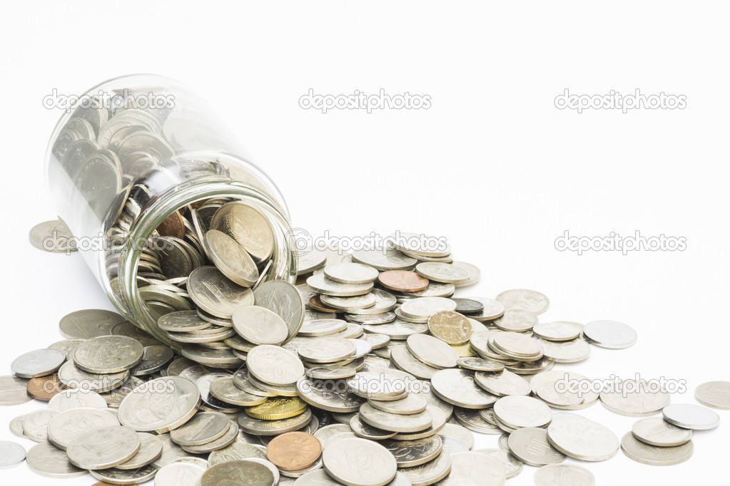 Coins spilling from a money jar.
