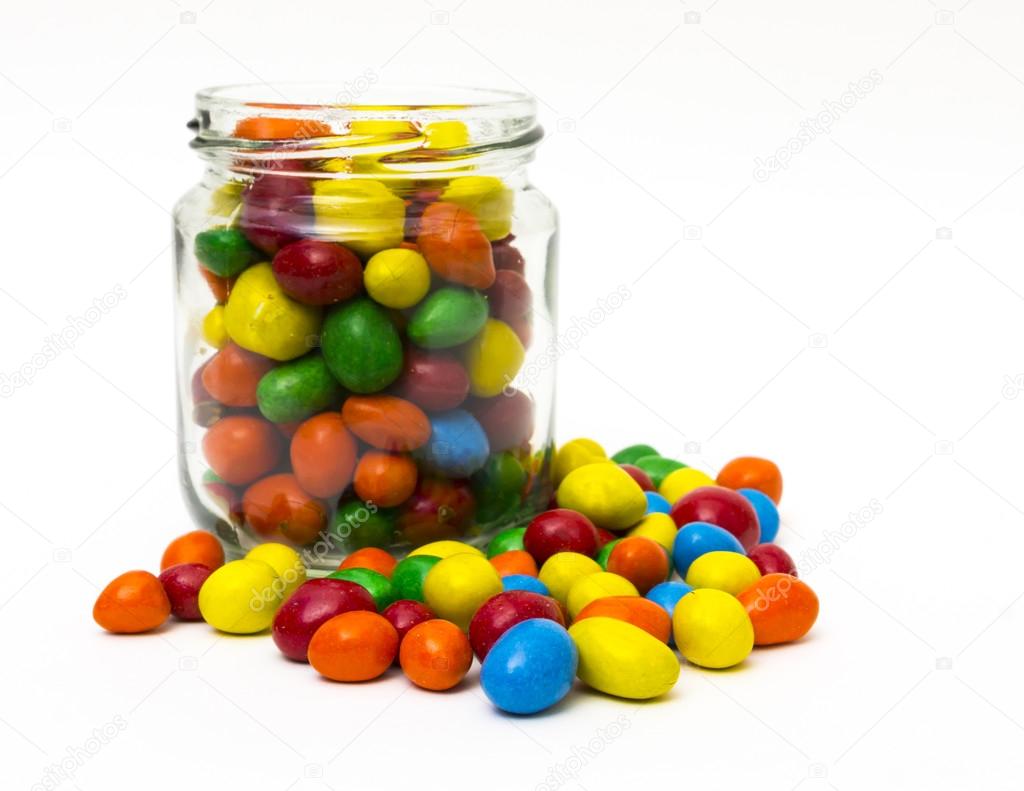 Isolated colorful candy inside and outside the jar - selective f