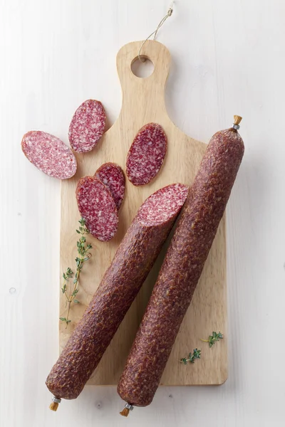 Salami on desk — Stock Photo, Image