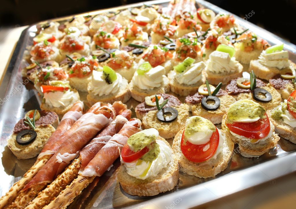 Variety of finger food on catering event. Shallow focus