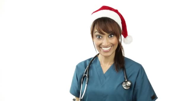 Nurse in Christmas hat showing sign — Stock Video