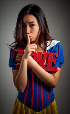 Attractive asian girl posing in studio clipart