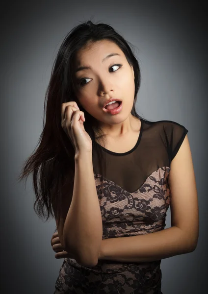 Attractive asian girl posing in studio — Stock Photo, Image