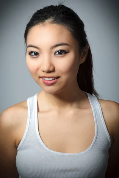 Attractive asian girl posing in studio — Stock Photo, Image