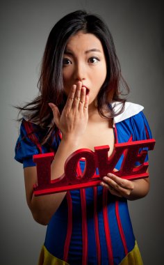 Attractive asian girl posing in studio clipart