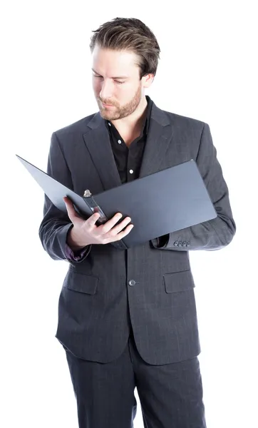 Attractive caucasian businessman reading documents in a folder — Stock Photo, Image