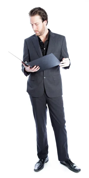 Attractive caucasian businessman holding a folder with documents — Stock Photo, Image