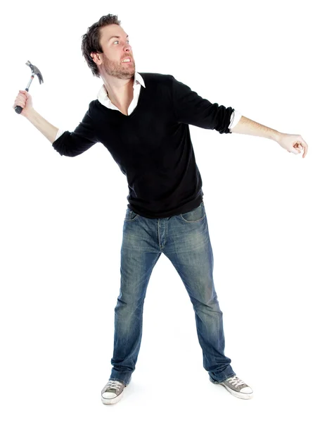 Attractive caucasian man brandishing with a hammer — Stock Photo, Image