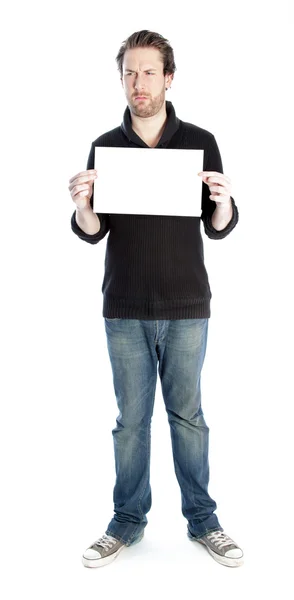 Attractive caucasian man holding a white sheet of paper — Stock Photo, Image