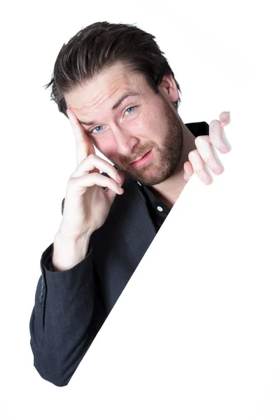 Attractive caucasian businessman holding a white banner. — Stock Photo, Image