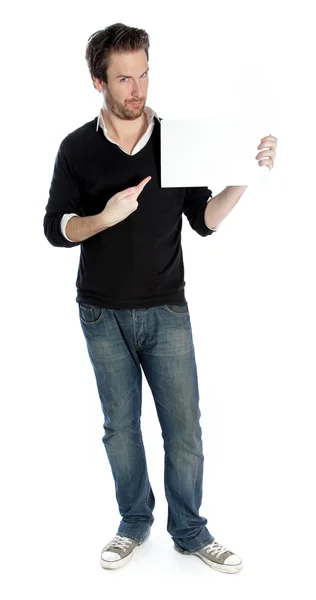 Attraente uomo caucasico punta con un dito su un foglio bianco di carta — Foto Stock