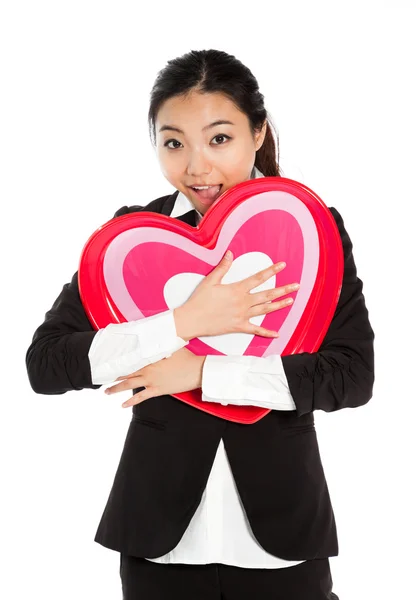 Girl holding heart in her hands — Stock Photo, Image