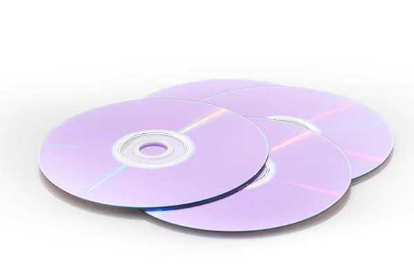 Quatro dvds isolados em um fundo branco — Fotografia de Stock