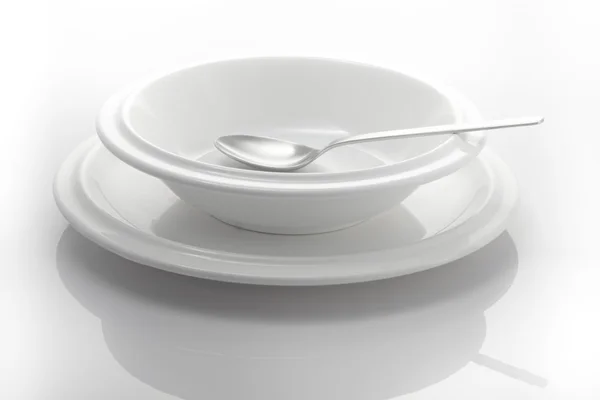 Dois pratos e uma colher — Fotografia de Stock