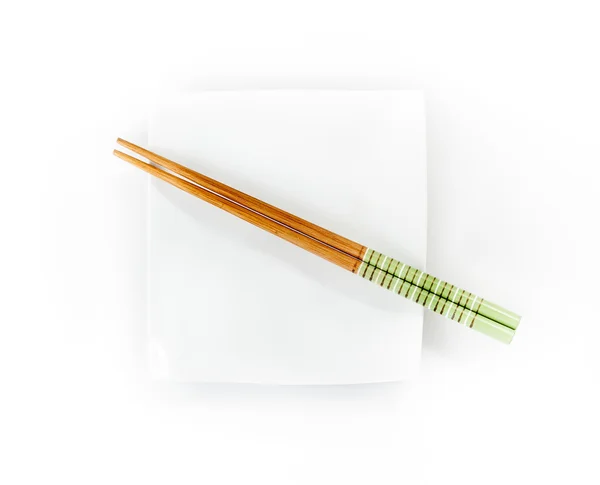 Chopsticks on a plate — Stock Photo, Image