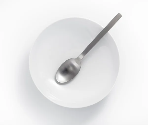 Spoon in an empty bowl — Stock Photo, Image