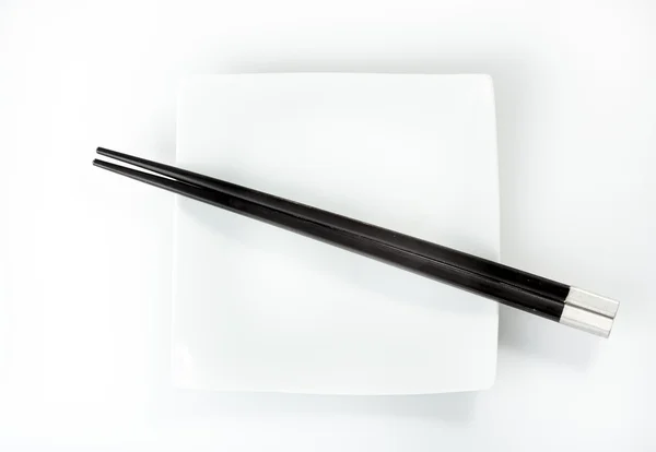 Chopsticks on a plate — Stock Photo, Image