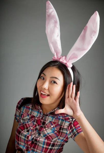 Portrait of sexy asian cowgirl wearing easter's bunny ears — Stock Photo, Image