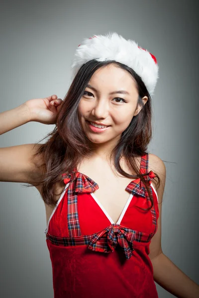 Sexy asian santa claus on grey backgroound relaxed — Stock Photo, Image