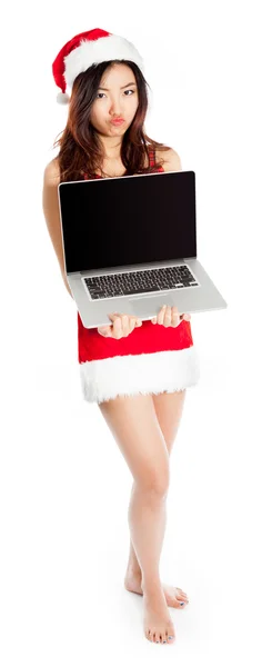 Sexy asian santa claus holding a laptop with blank screen — Stock Photo, Image