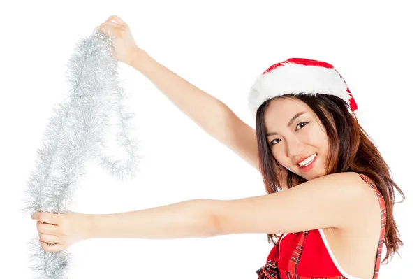 Sexy asian santa claus hanging a garland — Stock Photo, Image