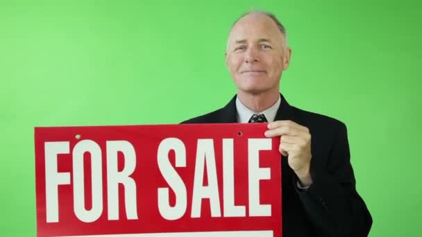 Senior businessman worried with for sale sign — Stock Video