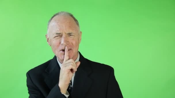 Senior businessman showing silence sign — Stock Video