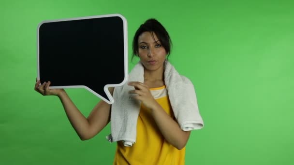 Sport woman upset with blank sign — Stock Video