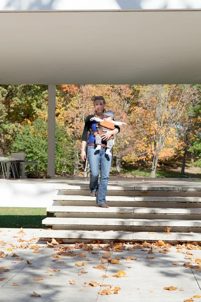 Woman carrying the baby — Stock Photo, Image