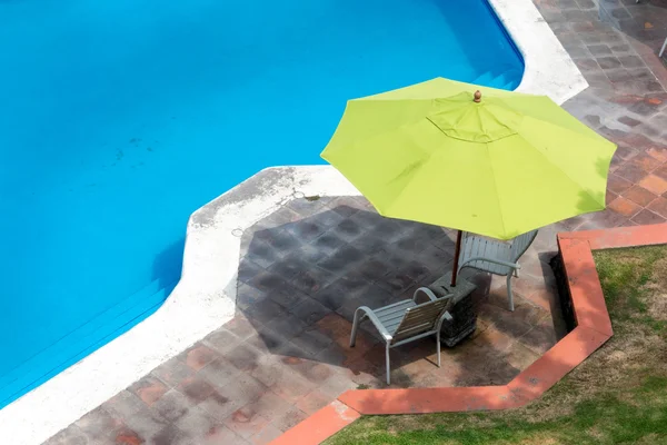 Umbrellas with chairs — Stock Photo, Image