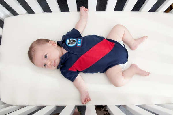 Baby in cot — Stock Photo, Image