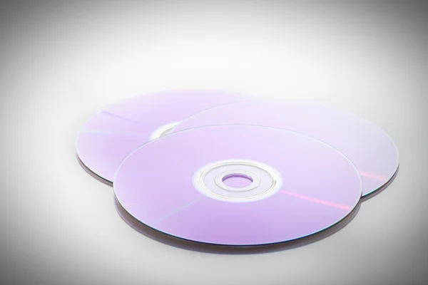 Three purple dvd — Stock Photo, Image