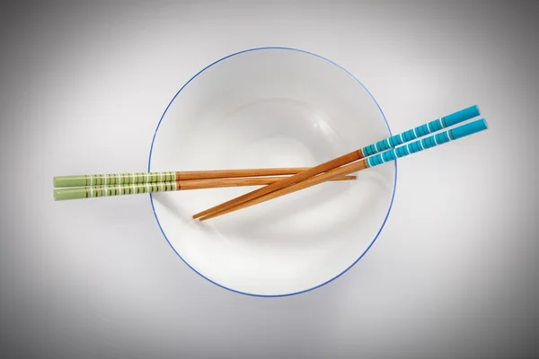 Pairs of chopsticks in bowl — Stock Photo, Image