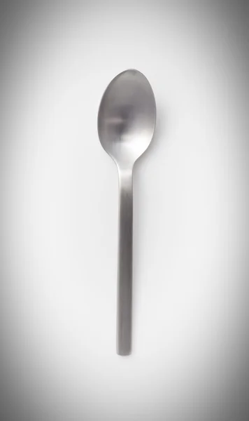 Empty stainless steel spoon — Stock Photo, Image
