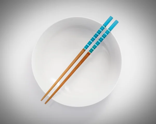 Chopsticks in bowl — Stock Photo, Image