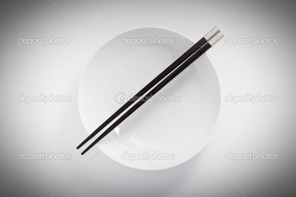Chopsticks in empty bowl