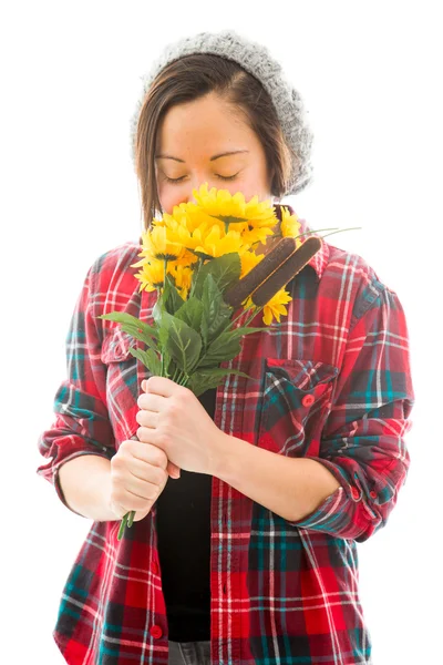 Woman smelling sunflowers — Stock Photo, Image
