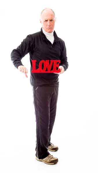 Hombre mostrando un texto de "Amor" — Foto de Stock